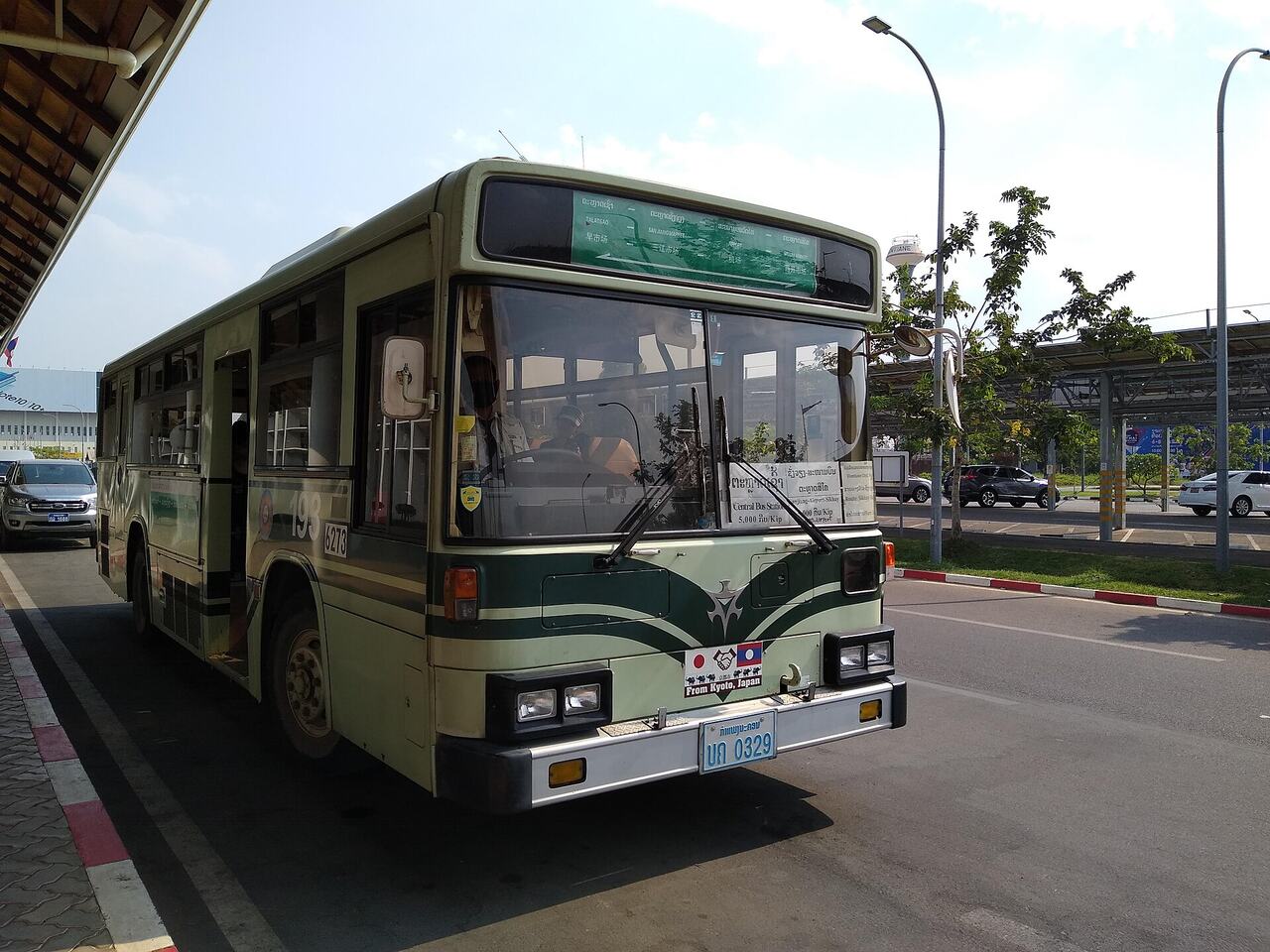 City bus stop with luggage traveler