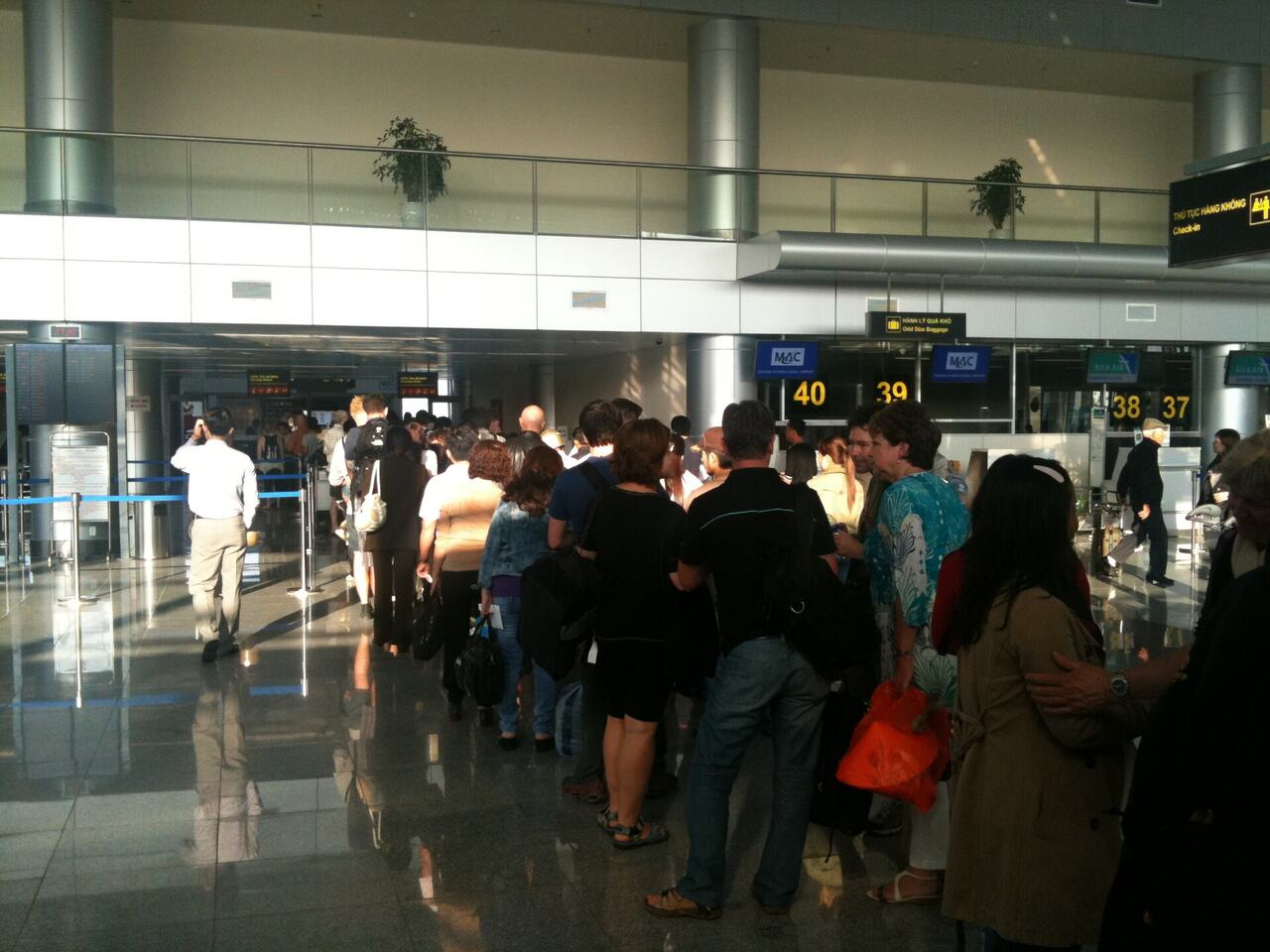 Airport security queue line passengers