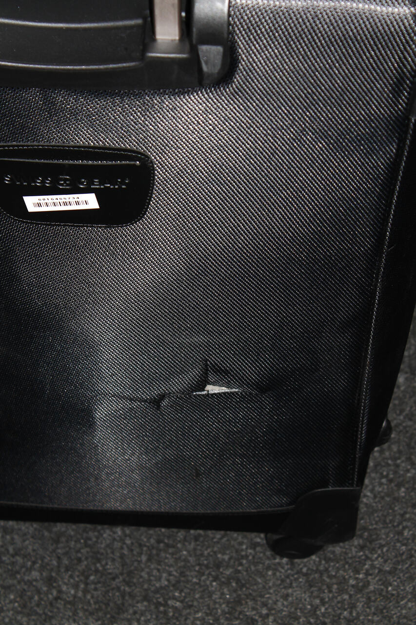Damaged broken suitcase wheel