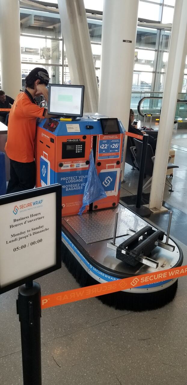 Suitcase wrapped plastic airport