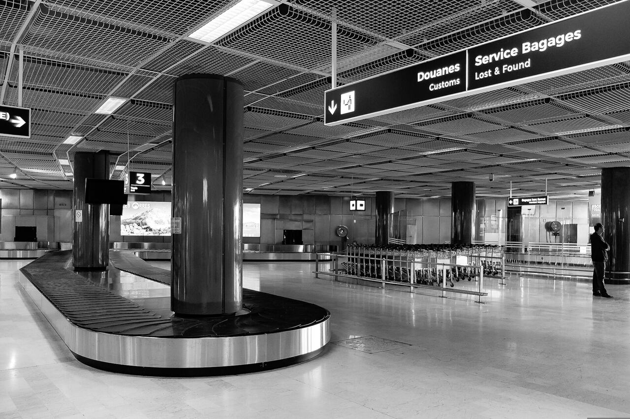Suitcases stacked warehouse airport