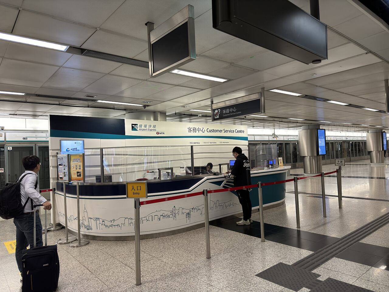 Traveler filling form desk airport
