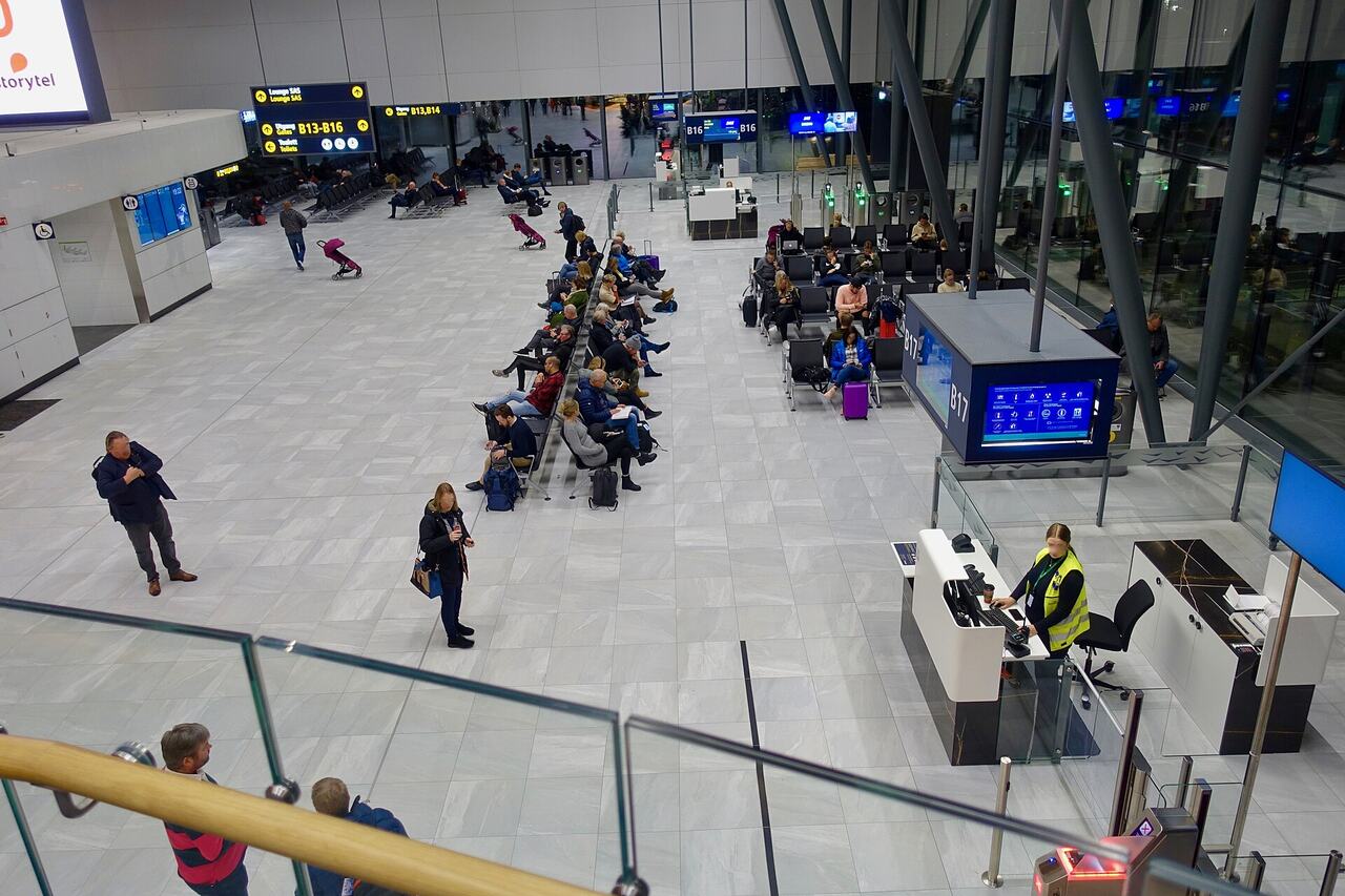 Passengers waiting gate airport delay