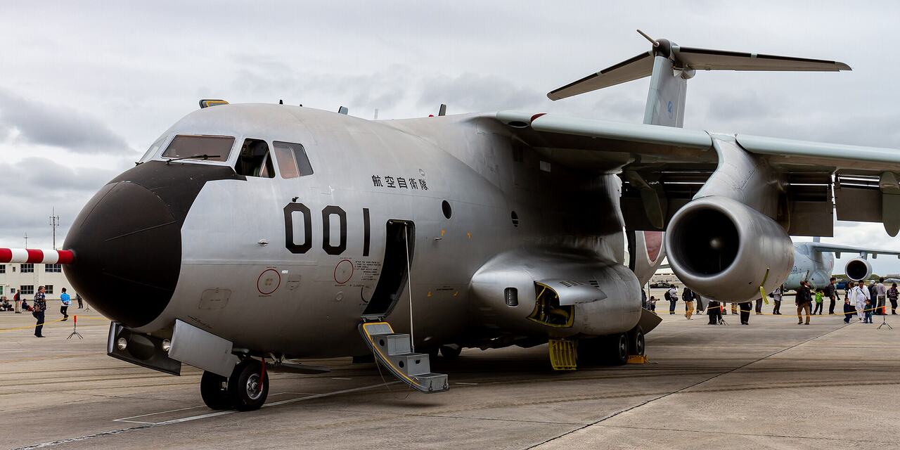 Aircraft parked at gate rain window